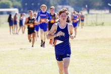 Perrin's Case Lambert competes in a meet earlier this season. The varsity Pirates team qualified for the regional meet after their third place finish in this morning's district meet at Perrin. Lambert finished in 10th place overall. (Photo/Kylie Bailey)