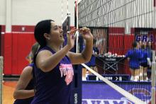 Lily Webster going up for a block on the right side of the net Friday, Aug. 8, against Graham. Webster had been trying to establish herself defensively in that spot all day and finally started to find her groove in the team's final match. 