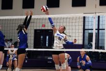 McKinlea Brasket tips a ball over the net for the Bryson Cowgirls. Brasket was pivotal at the front net for the team's win over Prairie Valley. 