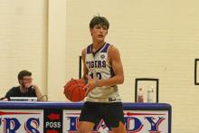 Brayden Rockey looks for an open man up court Tuesday, Sept. 30, in Graham fall league basketball. The Tigers went 2-0 on the night against Olney and Wichita Falls Christian. Photo/Alex Havardansky