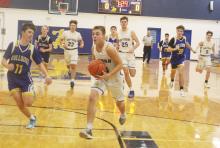 Jameson Pierce leads a group of players to the basket Tuesday, Dec. 17  during Bryson’s 68-39 win over Prairie Valley. Pierce had 17 points in the victory. Photo/Brian Smith