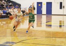 Bryson’s Jaydah McComack (3) drives past Newcastle’s Catherine Youngblood in first half action. The Lady ‘Cats remained perfect in district play with a 57-17 road win. Photo/Brian Smith