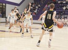 Jameson Pierce plays defense on the Bellevue player. Pierce had six points in helping Bryson snap a 32-year playoff win drought in a 54-47 win over the Eagles. Photo/Brian Smith