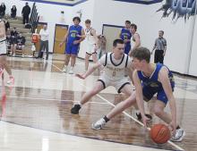Perrin’s Hunter Walker (1) plays defense on Bryson’s Gavin Sadler during the Tuesday, Jan. 21 game. Walker and the Pirates remained unbeaten in district with a 64-35 win. Photo/Brian Smith