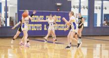 Eleanor Neudorf (15) looks to pass to Joslyn Whitfill during first half action Tuesday, Jan. 14 of Bryson’s 32-17 loss to Woodson. Whitfill led Bryson with eight points. Photo/Brian Smith