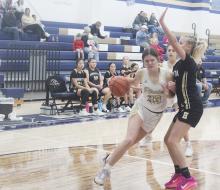 Perrin 1 – Callie Weddle muscles her way inside against the Henrietta JV defender. Weddle led Perrin with 15 points in the 35-20 victory. Photo/Brian Smith