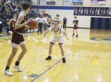 Hunter Walker plays defense on the Saint Jo player during Perrin’s 75-38 win over the Panthers in a Class A Division I bi-district matchup. Photo/Brian Smith