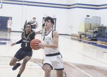 Jack McCormick drives to the basket on Tuesday, Jan. 7 in a home game vs. Newman Academy. McCormick had 36 points as the Pirates had one of their best shooting nights of the year in a 107-45 win. Photo/Brian Smith