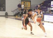 Jacksboro junior Brayden Rockey dribbles to get into the lane. Rockey had 8 points, including two 3-pointers, in the Tigers’ 65-17 win over Eastland. Photo/Brian Smith