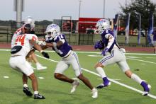Issak Wesson, 2, runs with his blocker Garrison Johnson, 14, into the open field during one of the Tigers’ matchups. The receiving game has been consistent all throughout the season in keeping the team successful. Photo/Ashley Anderson