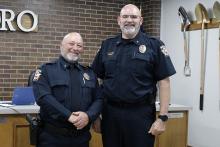 Jacksboro Police Chief Jerry Penny (right) welcomes lieutenant Alvin Bilby to the department following a swearing in and badge pinning ceremony Monday, Aug. 11 at City Hall. Photo/Ashley Anderson