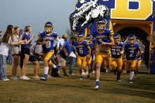The Bryson Cowboys run out of the tunnel during one of the teams matches. The Cowboys fought hard but lost to the Northside Indians in their matchup Friday, Oct. 31.  Photo/Ashley Anderson