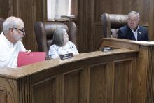 Jack County commissioners talk about last minute budget changes before approving the budget and tax rate for fiscal year 2025-2026. Pictured from left is Commissioner Gary Oliver, Commissioner Amy Salazar and Jack County Judge Keith Umphress. Photo/Ashley Anderson