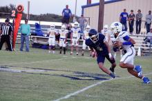 Nate Scruggs chases after a runner with the ball during one of the Pirates matches earlier in the season. Scruggs is one of the graduating seniors from this year’s team. Photo/Ashley Anderson