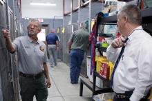 Jacksboro Animal Control Officer Michael Booher shows Jack County Sheriff's Office Chief Deputy Doug Angell how the animal shelter keeps track of information on each animal, including its age, breed and any medical conditions or treatment. The county toured the shelter before commissioners court Wednesday, Oct. 15 after contributing $25,000 to Friends of the Jacksboro Animal Shelter. Photo/Ashley Anderson