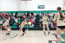 Callie Weddle goes up for a block against Newcastle in their match Friday, Oct. 10. The team continued their hot start in the district with their win over the Ladycats. Photo/Ashley Anderson