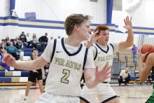 Cooper Walker, 2, and Noah Morris, 1, play up on defense Monday, Jan. 5 against the Clifton Cubs. Morris scored six points on a pair of three pointers while Walker scored 13 points from all levels of the court in the Pirates’ 50-44 win over the Cubs. Photo/Alex Havardansky