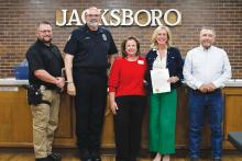 The city of Jacksboro proclaims April as Child Abuse Prevention and Awareness Month. Pictured from left is JPD Officer James Henry, Police Chief Jerry Penny, Children’s Advocacy Center for North Texas Director of Development Melanie Belcher, CEO Kristin Howell and Jacksboro Mayor Alton Morris. Photo/Ashley Anderson
