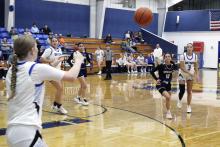 Jaydah McComack passes the ball to a teammate Tuesday, Dec. 16 against the Harrold Lady Hornets. The Cowgirls lost to the Lady Hornets 42-36. Photo/Ashley Anderson