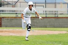 Keagan Nevarez races to first base in a previous matchup against Bryson. The Perrin-Whitt Pirates entered the postseason after winning 10 consecutive games. Photo/Ashley Anderson