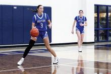 Jaydah McComack takes the ball up the court in one of the Cowgirls previous matchups. The Cowgirls fought hard but lost their bi-district matchup Monday, Feb. 16 to the Bellevue Lady Eagles 62-29. Photo/Ashley Anderson