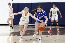Kadie Dugan dives for a ball Friday, Jan. 9 against the Bryson Cowgirls. Dugan scored five points in the Lady Pirates’ 56-23 win over the Cowgirls. Photo/Ashley Anderson