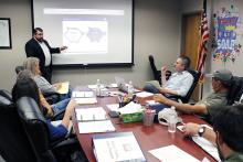 Live Oak Public Finance municipal market advisor John Blackburn explains to Bryson ISD school board members the impact of their Chapter 313 agreement with Hecate Energy Longhorn Solar LLC, set to enter the 10-year limitation period in January 2026. Photo/Ashley Anderson