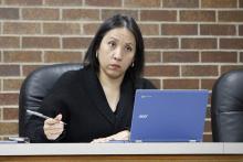 Jacksboro City Council Member Libby Gonzales considers bids for the removal of trees and brush from county-owned property leased by the city on FM 3344. The city awarded the bid to D&D Services at the Monday, March 23 city council meeting. Photo/Ashley Anderson