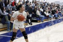 Baylee Meadows looks to pass the ball to a teammate Tuesday, Dec. 9 against the Graford Lady Rabbits. The Lady Pirates fought hard against the Lady Rabbits in an overtime loss 30-24. Photo/Ashley Anderson
