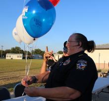 Jacksboro Police Lt. Connie McGee hands out balloons during the 2016 National Night Out event. This year’s National Night Out will be Tuesday from 6-8 p.m. at the Jacksboro Middle School.