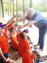 Jacksboro Elementary students learn about different types of foliage with Martha Hackley Salmon during their visit to Richards Ranch as part of the Kids on the Land program. The annual event provides a hands-on learning experience teaching children about the land that sustains them and how to protect it. 