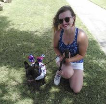 Quigley and owner Caitlin Fudge pose for a photo after Quigley won the My Pet’s the Best contest hosted by the Friends of the Jacksboro Animal Shelter during TNT Fest Saturday.