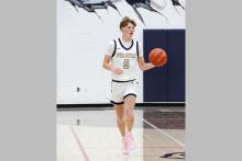 Case Lambert drives the ball up the floor Tuesday, Dec. 9 against the Graford Rabbits. Lambert scored seven points in the Pirates’ loss to the Rabbits 61-38. Photo/Ashley Anderson