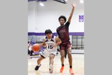 Josh Salazar drives to the basket Tuesday, Jan. 20 against the Vernon Lions. After starting district play with two losses, the Tigers bounced back by defeating the Lions 60-51. Photo/Ashley Anderson