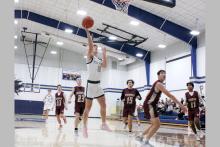 Case Lambert lays the ball up in one of the Pirates previous matchups. Lambert led the team in scoring with 19 points in the Pirates loss Tuesday, Dec. 2 to the Moguls 59-53. Photo/Ashley Anderson