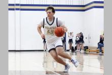 Travis Welch runs up court Thursday, Jan. 22 against the Garner Longhorns. Welch scored nine points in the Pirates’ 68-37 win over the Longhorns. Photo/Ashley Anderson