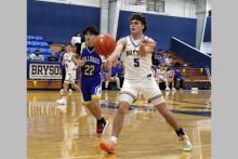 Caleb Allen passes the ball to a teammate in one of the Cowboys’ previous matchups. Allen scored 14 points in the Cowboys’ 50-22 win Thursday, Jan. 22 against the Throckmorton Greyhounds. Photo/Ashley Anderson