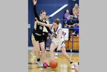 Jaylee Herpeche fights her way past a defender Friday, Feb. 6 against the Woodson Cowgirls. Herpeche was the lone senior for the team who was honored on senior night. Photo/Ashley Anderson
