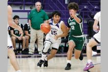Josh Salazar dribbles the ball past a defender Monday, Dec. 22 against the Breckenridge Buckaroos. The Tigers fought hard in their matchup before the Christmas break but lost 43-39. Photo/Ashley Anderson