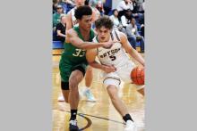 Caleb Allen drives to the basket Friday, Jan. 16 against the Newcastle Bobcats. Allen led the way for the Cowboys in scoring with 38 points in the Cowboys’ 52-49 win. Photo/Ashley Anderson