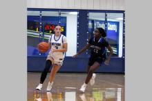 Jaydah McComack drives past a defender in one of the Cowgirls’ previous matchups. McComack scored eight points in the Cowgirls’ loss Tuesday, Dec. 9 to the Archer City Lady Cats 48-20. Photo/Ashley Anderson