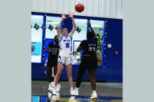 Joslyn Whitfill looks up to catch the ball in one of the Cowgirls previous matchups. Whitfill led the Cowgirls in scoring Tuesday, Dec. 2 against the Slidell Lady Greyhounds in their 63-15 loss with seven points. Photo/Ashley Anderson