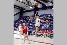 Kennedy Lowther jumps in the air and puts a ball up for a layup in one of the Tigerettes’ previous matchups. The Jacksboro Tigerettes defeated the Bowie Lady Rabbits in their matchup Saturday, Jan. 3 by a final score of 56-39, improving their district record to 3-0 after the matchup. Photo/Ashley Anderson