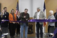 Former Jacksboro ISD Ag teacher Joe Ray BurkettFormer Jacksboro ISD Ag teacher Joe Ray Burkett cuts the ribbon on the newly dedicated Burkett Event Center Tuesday, Dec. 2. Burkett was recognized for shaping generations of students through his leadership, mentorship and passion for agricultural education. Photo/Ashley Anderson