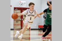 Wiett Newton drives to the basket Thursday, Feb. 19 against the Newcastle Bobcats. Newton scored 10 points in the Cowboys’ matchup against the Bobcats. Photo/Ashley Anderson