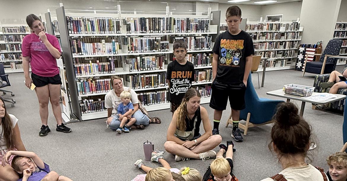 Kids gather 4-H sponsor Bailey Clack as she talks about hatching chicks. Jack County 4-H is partnering with the Gladys Johnson Ritchie Public Library to host the summer reading program throughout June. Contributed photo