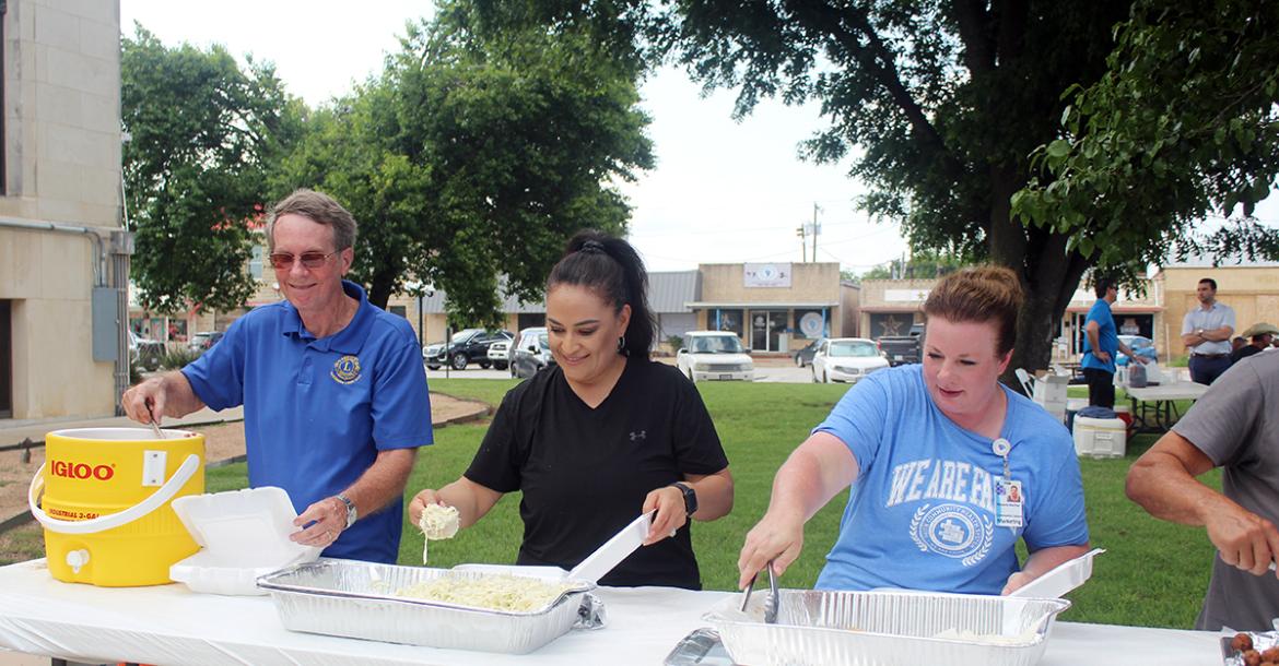 Tim Cassle, Nuvia Salazar and Melanie Belcher serve up the sides during last year’s annual Jacksboro Lions Club fish fry fundraiser. This year’s event is set for Thursday, June 4 on the east side of the Jack County Courthouse. Archive photo