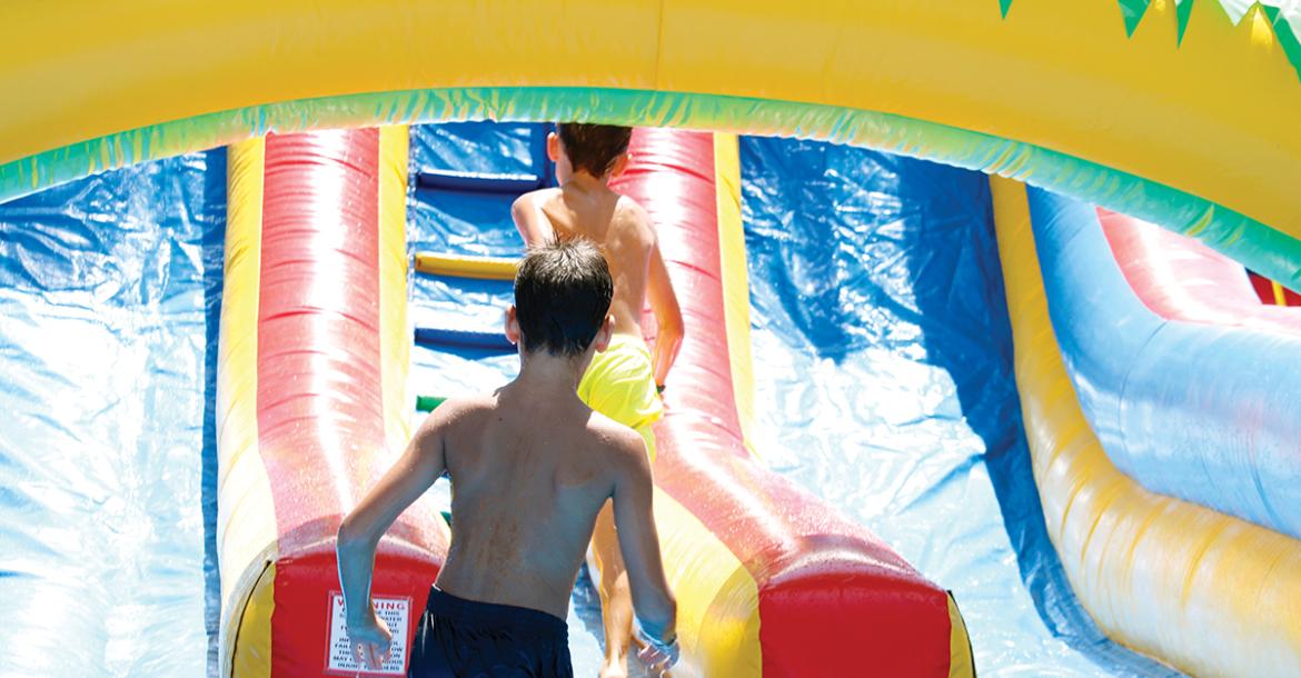 Kids play in water-filled bounce houses to stay cool at TNT Fest last year. Food, fun and entertainment returns to the Jack County Courthouse square Saturday, June 27 in Jacksboro. Archive photo